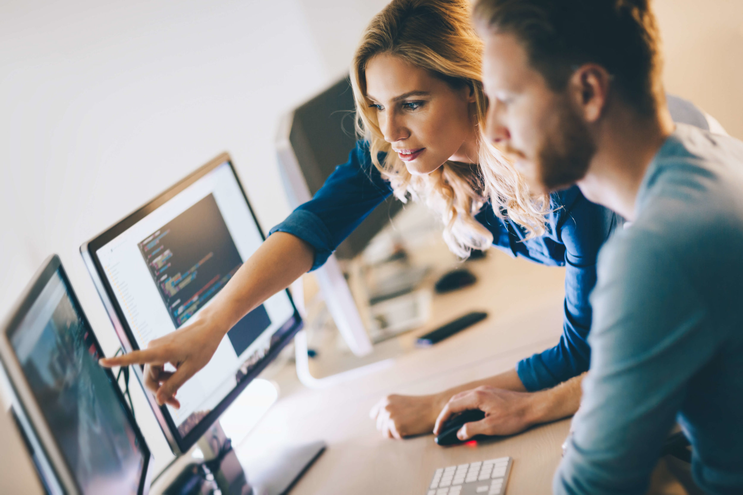 Woman and man using computer